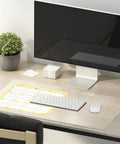 Clear 14 By 24 Inch Table Cover Protector With 1.5mm Thick Vinyl Desk Mat on a desk with computer, keyboard, and calendar