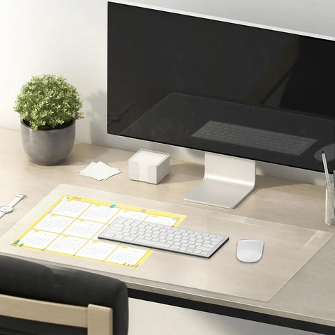 Clear 14 By 24 Inch Table Cover Protector With 1.5mm Thick Vinyl Desk Mat on a desk with computer, keyboard, and calendar