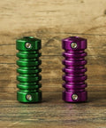 Green and purple grips from Four Coil Tattoo Machine Kit Set For Lining Shading And Coloring With Power Supply Foot Pedal Cartridges