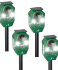 Four green Motion Activated Solar Ultrasonic Animal Repellers with LED flashing lights for outdoor use.