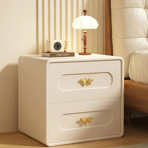 Heavy Duty Butterfly Cabinet Knobs With Slick Brushed Gold Finish For Dressers crafted from solid brass on a wooden nightstand.