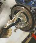 8 Inch 3 Jaw Gear Puller Removal Tool Workhorse For Slide Gears Pulleys And Flywheels Gold Finish in action on flywheel