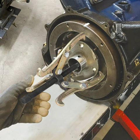 8 Inch 3 Jaw Gear Puller Removal Tool Workhorse For Slide Gears Pulleys And Flywheels Gold Finish in action on flywheel