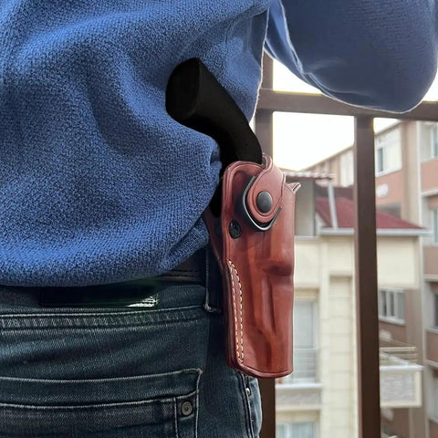 Person wearing OWB Leather Paddle Revolver Holster With Retention Strap For Pietta 1858 Ace Black Powder 44 Cal 3 Inch