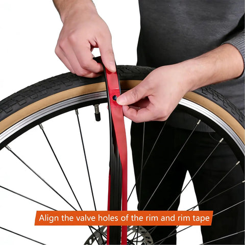 Applying Rim Strip Protector For Road And Mountain Bikes, High Strength Nylon Anti Puncture Rim Liner on bicycle wheel.