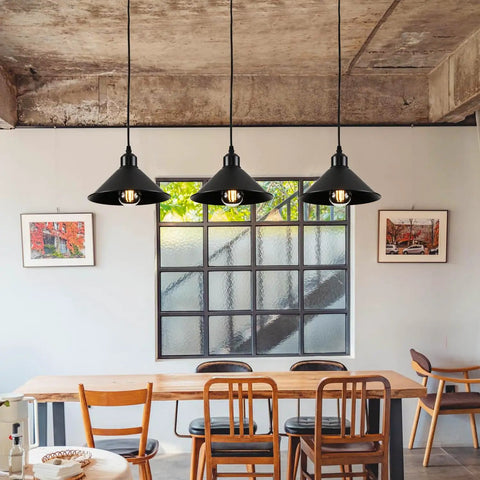 Heavy Duty Black Plug In Pendant Lights 2 Pack Industrial Hanging Lamps With 15 Foot Adjustable Cord And Switch over a dining table.