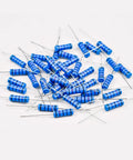 Scattered blue color-coded resistors from 3W Metal Film Resistor Kit, 125 Pieces, 25 Value Assortment from 0.68 Ohm to 1 Megohm.