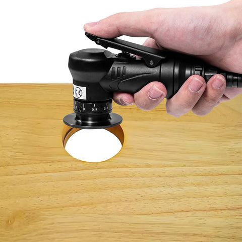 Front view of a black handheld pneumatic chamfering tool with a 1/4 in air inlet and depth dial beveling wood edge.