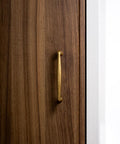 Antique Brass Zinc Alloy Cabinet Pulls With Three And Three Quarter Inch Hole Centers installed on wooden cabinet door