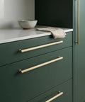 Go-To Champagne Bronze Cabinet Pulls Set Of 6 With Ribbed Knurled Texture And Anti Fingerprint Finish on green cabinets