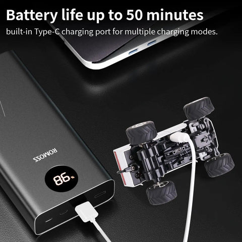 Mini 1:64 Scale Monster RC Truck With Lights charging via USB-C with power bank, showcasing durable body and battery life