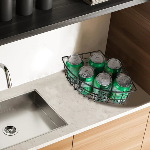 Black metal corner Lazy Susan basket under kitchen cabinet, 9x6.2x4 in, holding cans.