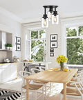Three Light Matte Black Dope Semi Flush Mount Ceiling Light With Clear Glass Shades in bright kitchen dining area.
