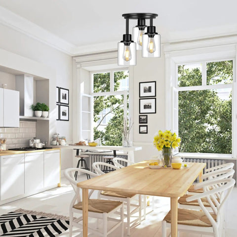 Three Light Matte Black Dope Semi Flush Mount Ceiling Light With Clear Glass Shades in bright kitchen dining area.