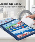 Nap Mat For Toddlers With Removable Pillow Fire Police Rescue Theme Roll Up Design next to washing machine, hands removing pillow.