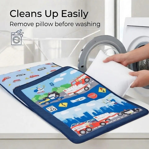 Nap Mat For Toddlers With Removable Pillow Fire Police Rescue Theme Roll Up Design next to washing machine, hands removing pillow.