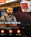 Beast 10000W Digital Garage Heater With Remote Control shown on wall in workshop, highlighting heating features and dual power settings.