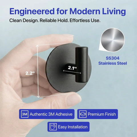 Heavy Duty Peel And Stick Wall Hooks Engineered For Clutter Free Homes Featuring No Sweat Setup, showing a hand holding a matte black hook.