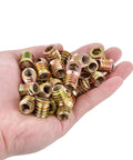 Hand holding 60 Pcs 5/16-18 Threaded Wood Inserts For Furniture And Cabinets, Nut And Bolt Inserts For Woodworking Projects, Heavy Duty And Easy Install