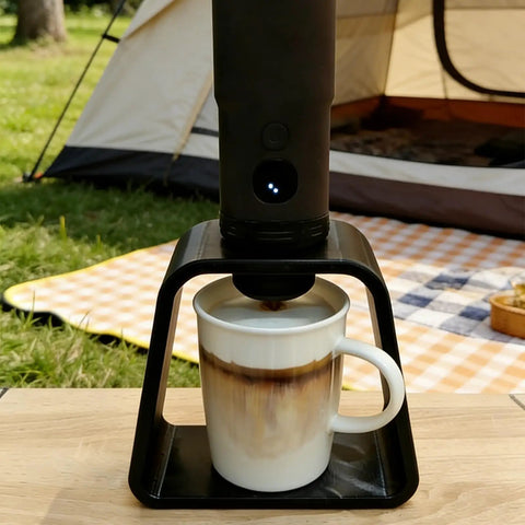 Secure Hands Free Espresso Stand For Portable Makers solid coffee dock holding espresso maker over a cup outdoors.