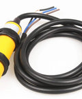 Rugged Proximity Photoelectric Sensor Switch E3F DS10P1 With 10 Cm Detection Range, showcasing its yellow housing and wiring.