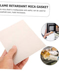 Hand holding flame retardant mica sheet, with images showing microwave installation and oven use. 10 Piece Mica Plates 150x120mm Microwave Heat Insulation And Fireproof Sheets Anti Oil Kitchen Accessory For Oven Use Durable High Temp Heat Shield For Heavy Use In Busy Kitchens.