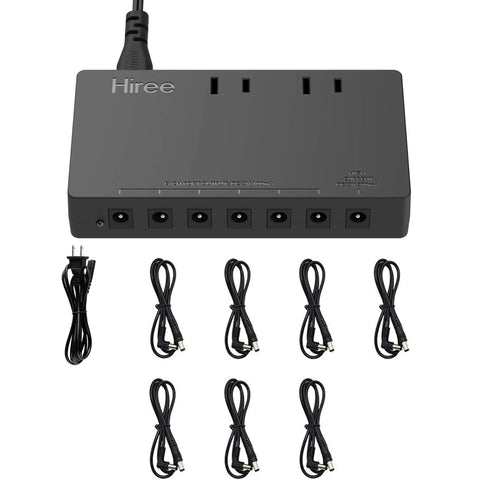 7 Way Isolated Guitar Pedal Power Supply With 9V 100mA Ports For Six Pedals And 9V 300mA Port For One, shown with cables