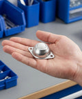 12 Pack Heavy Duty Metal Roller Ball Transfers Rolling Smooth As Butter With 360 Degree Swivel and Plug And Play Screw Mount in hand.