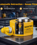 Yellow hydraulic tool on workbench in workshop, featuring automatic retraction and strong lifting force for industrial use.