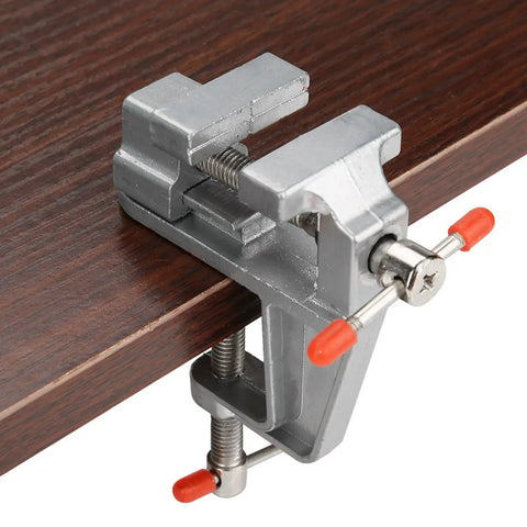 Must-Have Compact Vistreck Mini Flat Pliers Vise Clamp With 360 Degree Rotating Aluminum Alloy Table Vice Tool mounted on wooden surface.