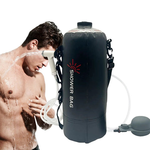 Foldable 12L Solar Heated Camping Shower Kit With Removable Hose And Showerhead in use outdoors by a man