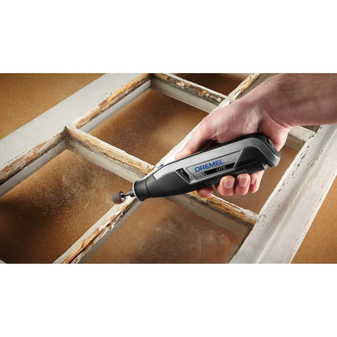 User holding an Ultra Compact Four Volt Cordless Rotary Tool Featuring Variable Speed And No Sweat Accessory Swaps for sanding trim.