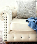 Heavy Duty Silver Thumb Tacks And Push Pins 50 Pack on a upholstered couch with silver accents and decorative pillow.