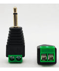 Close-up of a 3.5 mm stereo audio jack adapter, one eighth inch male to two pin female screw terminal, for hassle free speaker wire hookups.