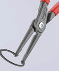 Knipex Internal Precision Snap Ring Pliers Go To Pro Grade Tool For Internal Circles, heavy-duty with red grips, holding a snap ring.