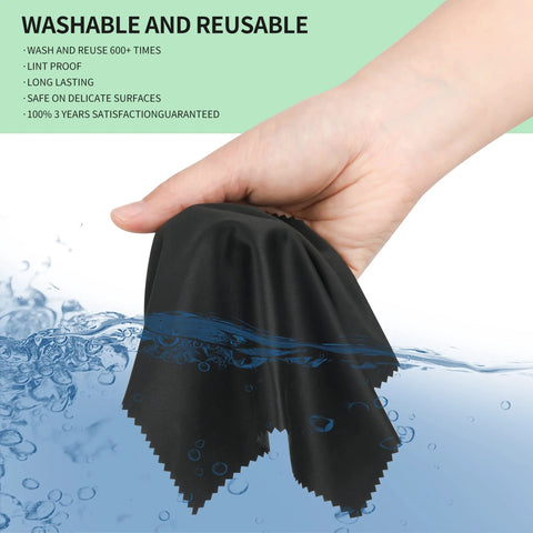 Microfiber cleaning cloth, black, 7 x 6 in, held in hand under running water