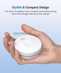 Photoelectric Smoke Detector With 10 Year Sealed Battery And Low Power Alert UL Certified For Home Bedroom 12 Pack held in hand showing compact size.