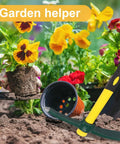 Dual Head 15 Inch Garden Pickaxe And Mattock Weeding Hoe with rubber handle beside a gardener planting flowers in soil