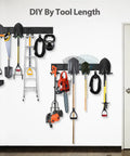 Heavy Duty Wall Mounted Tool Organizer Rack With 3 Rails And 6 Removable Hooks holding tools in garage or workshop.