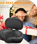 Ultra Wide Bike Seat Cushion With Extra Padding And Back Rest For Men And Women, Oversized Comfortable Cushy Saddle For Peloton, Exercise, Electric, Mountain, Spin And Cruiser Bikes. Black padded bike seat with back rest shown on gift-themed background.