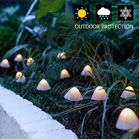 Mushroom Solar String Lights 15-Piece Set 29.5 Ft Total Warm White 8 Modes Outdoor Fairy Lights in a garden setting
