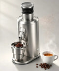 Single Dose Coffee Grinder With 80MM Flat Burrs And Variable Speed Control For Smooth As Silk Pulls Plus 550W Brushless Motor With Adjustable Dial For Real Deal Espresso Perfection In A Heavy Duty Black Body That Gets It Done Right, showing ground coffee and steaming espresso.