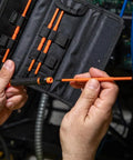 Person holding 8-In-1 Insulated Screwdriver Set With Case 1000V Rated Includes Phillips 00 And 0 Slotted 3/32 And 1/8 Tamperproof Torx T7H T8H T10H T15H Pro-Grade Electrician And DIY Tool Kit
