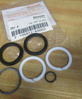 Hydraulic seal kit P-106872-K0002 replacement P106872K0002 single pack with O-rings for pumps, valves, and cylinders on a wooden surface.