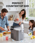 Sleek Countertop Ice Maker With Portable Stainless Steel Design And Easy Carry Handle in kitchen setting with drinks.