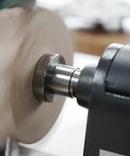 Rugged As A Nail Heavy Duty Steel Wood Lathe Faceplate Three Inches Diameter mounted on lathe, clamping wood for shaping.