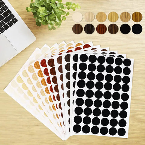 648 Piece Screw Hole Cover Sticker Set In 12 Colors, Adhesive PVC Caps For Wood Screws displayed on a desk.