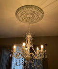 Plug-In Five Light Crystal Chandelier Swag Hanging Fixture With White Metal Frame And Clear Glass Stems And Acrylic Crystals Ideal For Nurseries Bedrooms Bathrooms Closets Hallways And Events hanging in room with lights illuminated