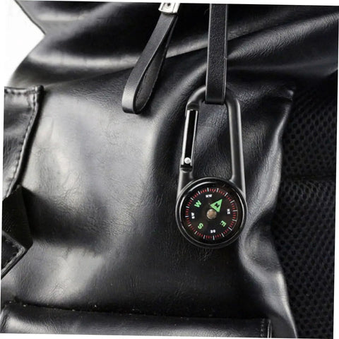 Two Pack Outdoor Hiking Compass With Carabiner Keychain clipped to black backpack for camping adventures