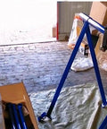 Driveway Ready Heavy Duty Foldable Engine Hoist Crane Lifter With 2200 Lbs Capacity in blue, assembled in garage setting.
